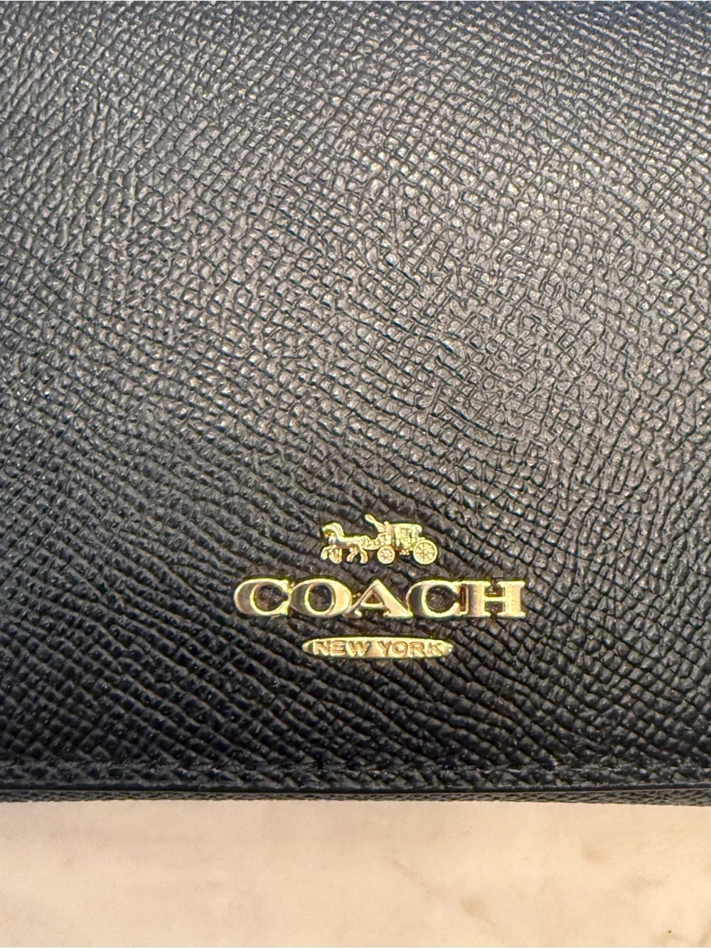 Coach Black Leather Clutch Wallet with Gold Accents